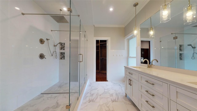 bathroom featuring vanity, crown molding, and walk in shower