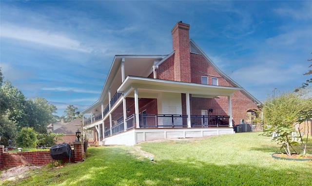 back of house featuring a yard