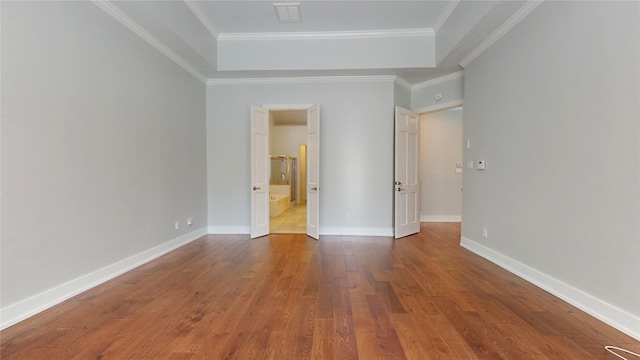 unfurnished bedroom featuring hardwood / wood-style flooring and ornamental molding