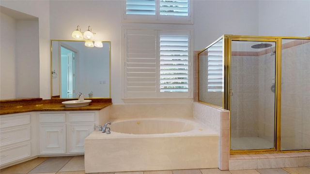 bathroom with tile patterned floors, vanity, and plus walk in shower