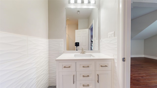 bathroom with vanity and hardwood / wood-style flooring