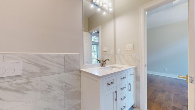 bathroom with hardwood / wood-style flooring and vanity