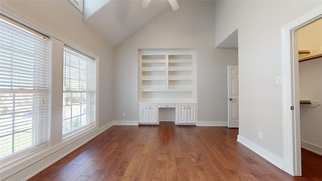 interior space featuring ceiling fan, dark hardwood / wood-style flooring, and vaulted ceiling