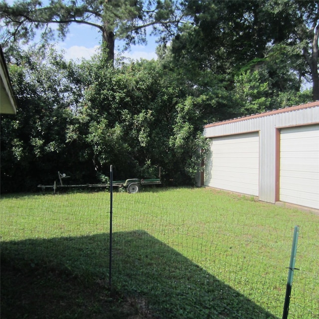 view of yard with a garage