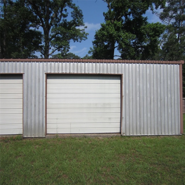 garage featuring a yard