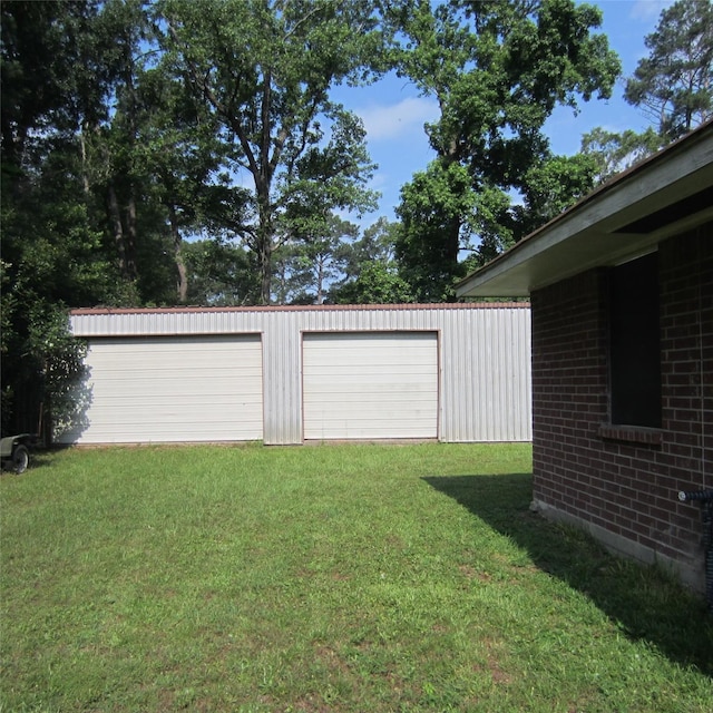 garage with a yard