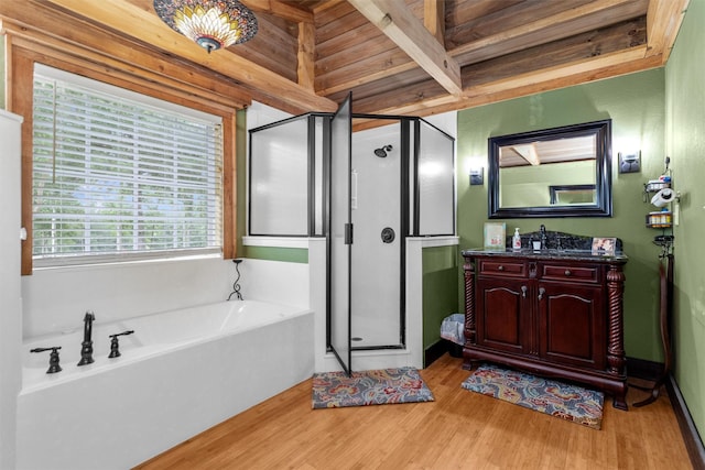 bathroom with hardwood / wood-style flooring, wood ceiling, vanity, and shower with separate bathtub