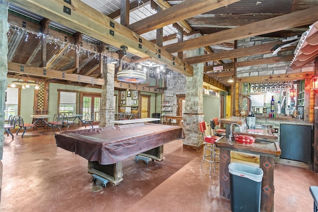 playroom with high vaulted ceiling, beam ceiling, concrete flooring, and pool table