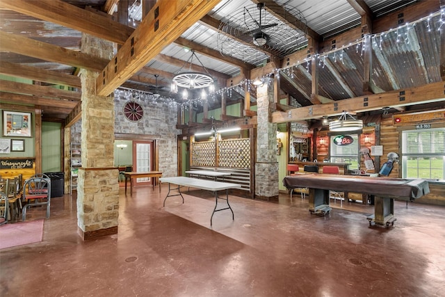 interior space featuring beamed ceiling, high vaulted ceiling, concrete flooring, and pool table