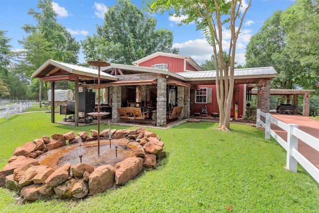 back of property featuring a patio area and a yard