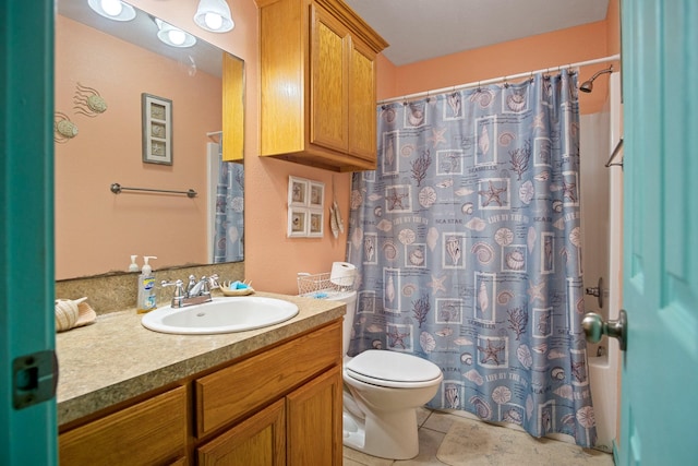 full bathroom with vanity, shower / tub combo, and toilet