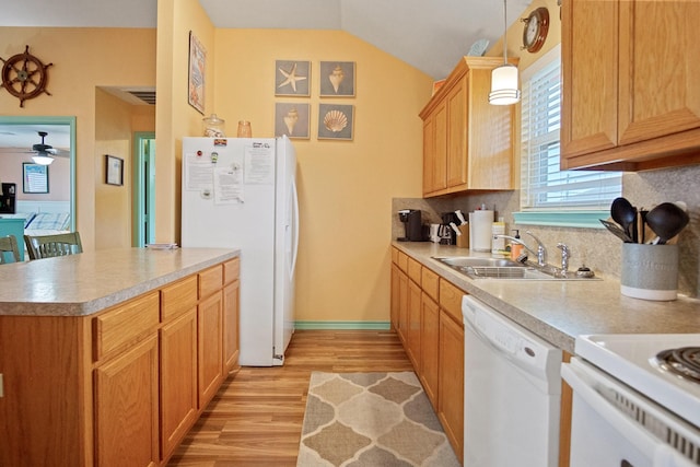 kitchen featuring decorative light fixtures, sink, backsplash, white appliances, and light wood-type flooring