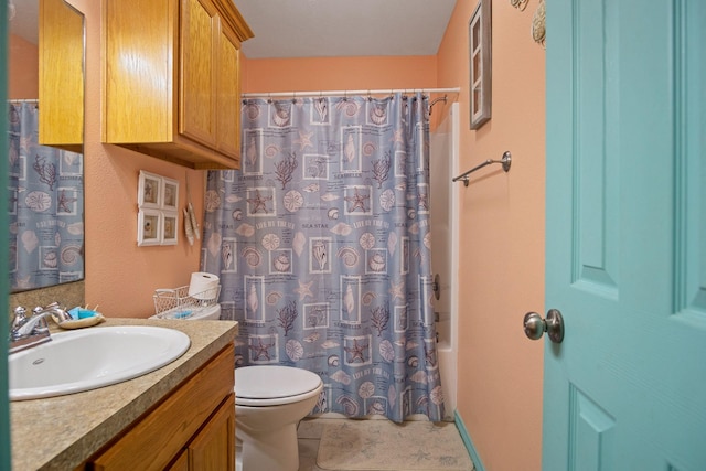 full bathroom featuring vanity, toilet, tile patterned flooring, and shower / bath combo with shower curtain