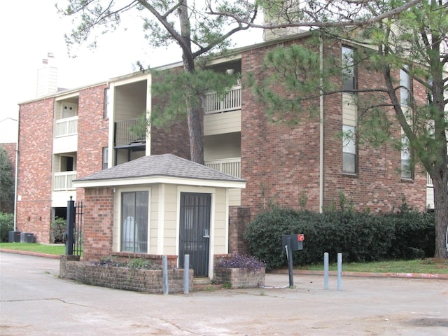 view of building exterior with central AC unit