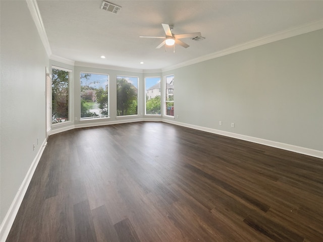 unfurnished room featuring ceiling fan, dark hardwood / wood-style flooring, and crown molding