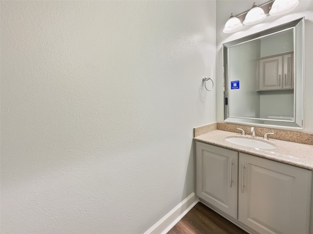 bathroom featuring wood-type flooring and vanity