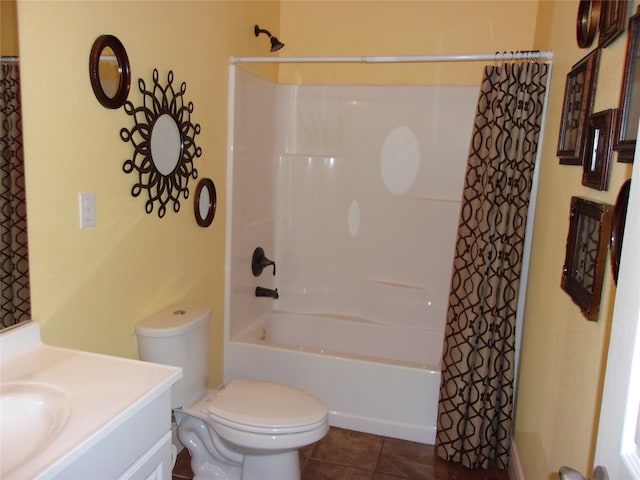 full bathroom featuring tile flooring, large vanity, toilet, and shower / bath combo with shower curtain