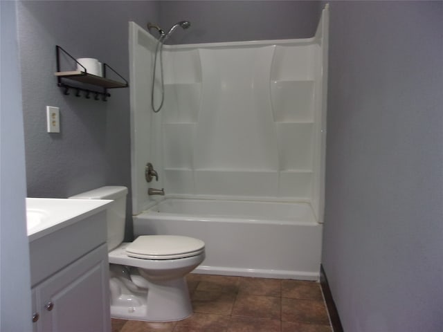 full bathroom with vanity, toilet, tile floors, and shower / bathtub combination