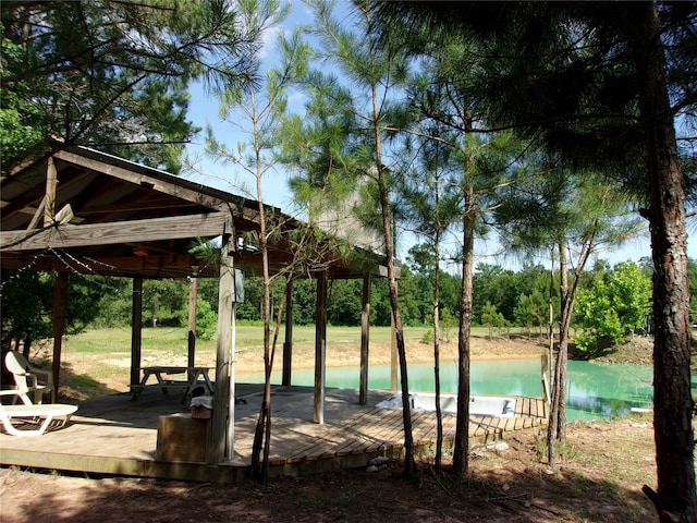 view of nearby features featuring a gazebo and a swimming pool side deck with water view