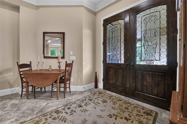 foyer entrance featuring french doors and ornamental molding