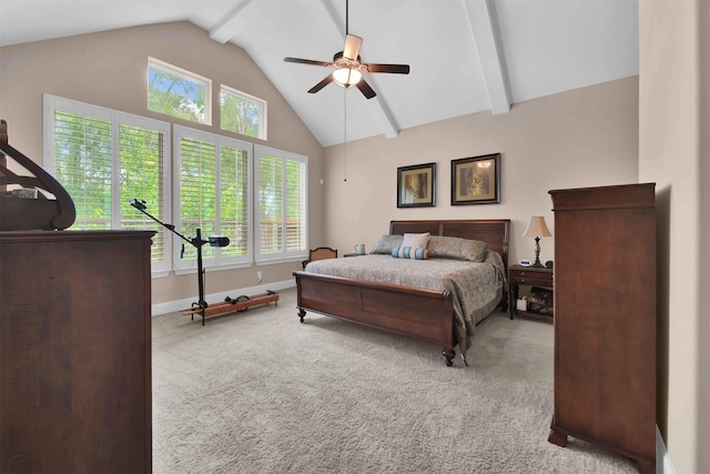 carpeted bedroom with multiple windows, ceiling fan, and lofted ceiling