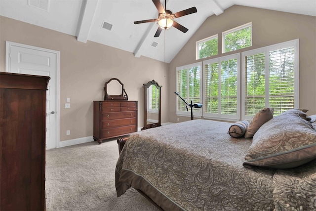 carpeted bedroom featuring multiple windows, vaulted ceiling, and ceiling fan