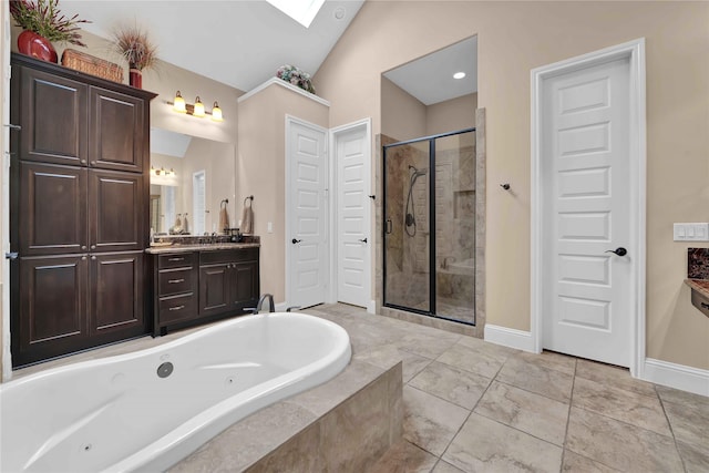 bathroom featuring vanity, vaulted ceiling, and separate shower and tub