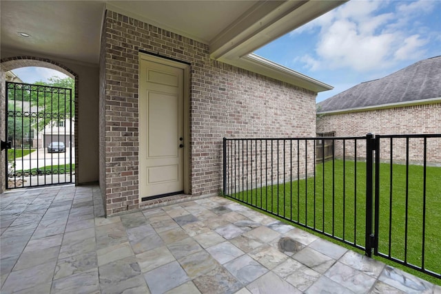 entrance to property with a yard