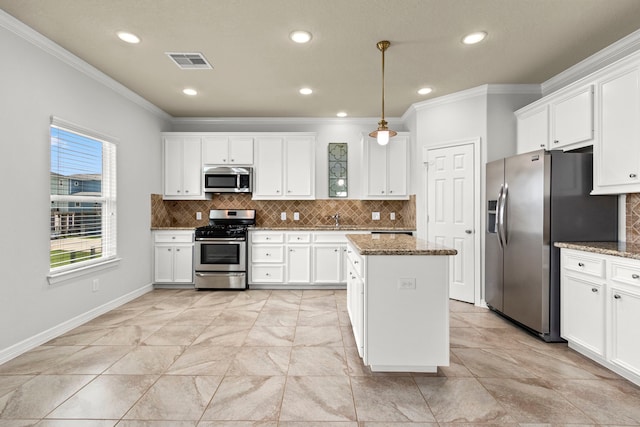 kitchen with white cabinetry, light stone countertops, and stainless steel appliances