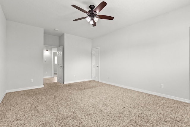 unfurnished room featuring ceiling fan and carpet floors