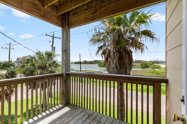 wooden deck with a water view