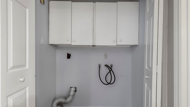 washroom featuring electric dryer hookup, cabinets, and washer hookup