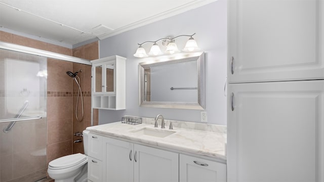 bathroom featuring walk in shower, ornamental molding, oversized vanity, and toilet