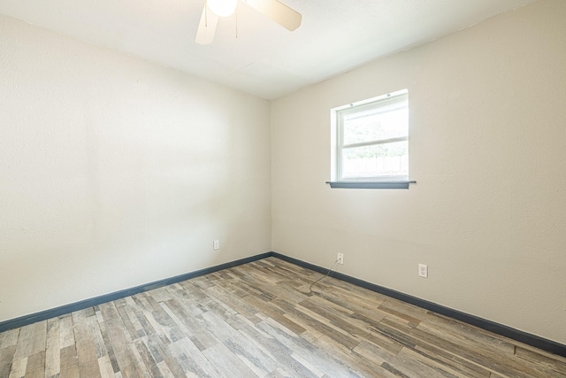 unfurnished room featuring hardwood / wood-style floors and ceiling fan