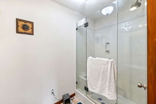 bathroom featuring tile flooring and walk in shower