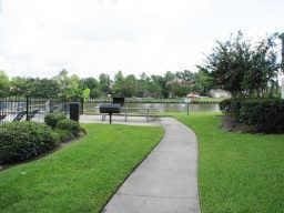 surrounding community featuring a lawn and a water view