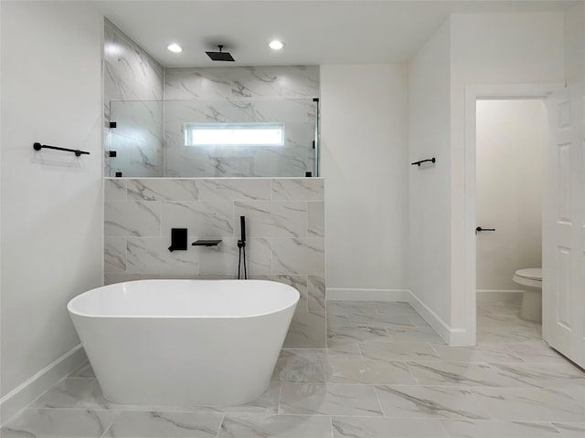 full bath featuring a freestanding tub, toilet, recessed lighting, marble finish floor, and a marble finish shower