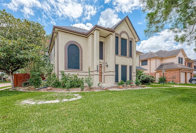 view of front facade with a front lawn and a garage