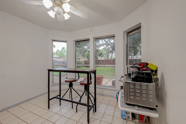 dining area with ceiling fan and light tile patterned flooring