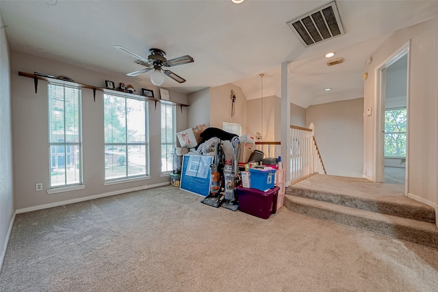 misc room with ceiling fan and carpet flooring