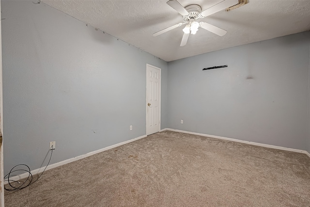 unfurnished room featuring carpet flooring, a textured ceiling, and ceiling fan