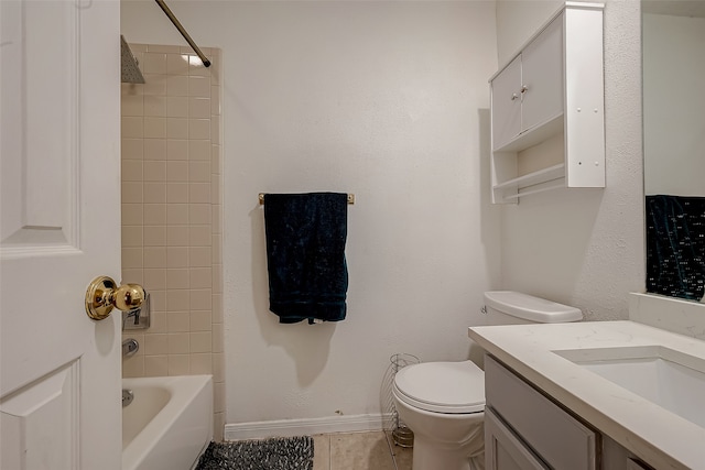 full bathroom featuring tile patterned floors, vanity, toilet, and tiled shower / bath