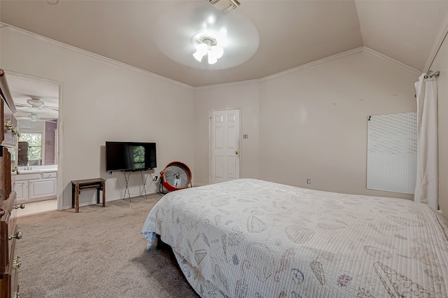 carpeted bedroom with crown molding, vaulted ceiling, and connected bathroom