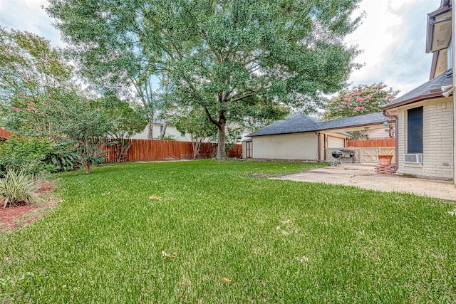 view of yard with cooling unit and a patio