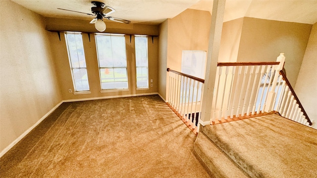 carpeted empty room featuring ceiling fan