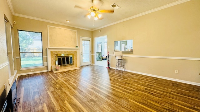 unfurnished living room featuring crown molding, ceiling fan, and hardwood / wood-style floors