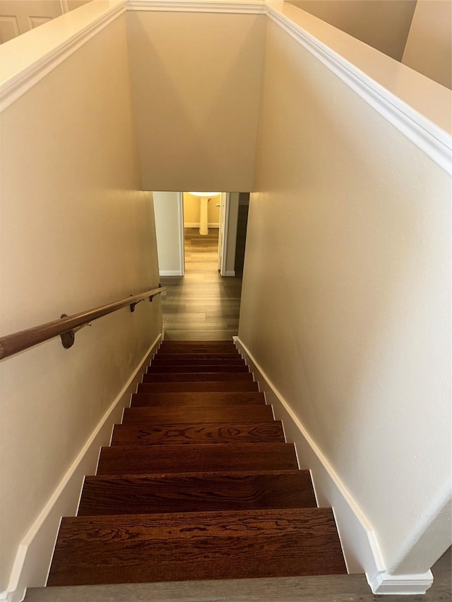 stairs with hardwood / wood-style floors