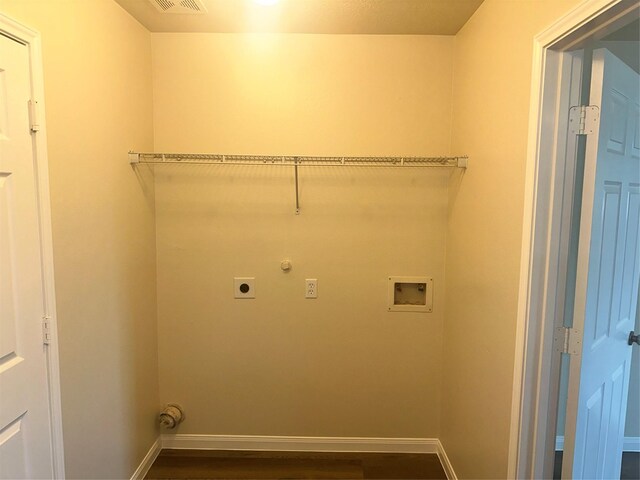 laundry room featuring hookup for an electric dryer, hookup for a washing machine, and dark hardwood / wood-style floors