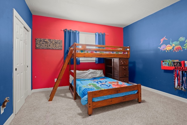 bedroom with a closet and carpet floors