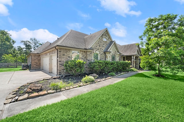 view of front facade featuring a garage and a front lawn